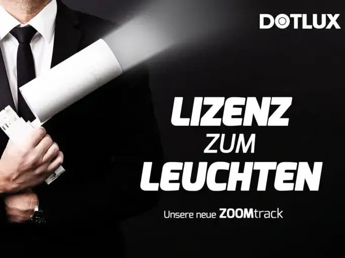 Werbegrafik von DOTLUX mit dem Slogan 'Lizenz zum Leuchten' und einem Mann im Anzug, der eine Leuchte wie ein Gadget hält, für die neue ZOOMtrack-Serie.