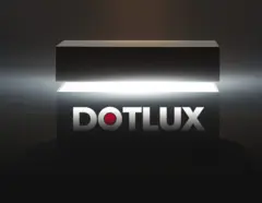 Ein leuchtender schwarzer Kasten mit geöffnetem Deckel und dem DOTLUX-Logo in der Mitte. Ein intensives Licht strahlt aus dem Inneren des Kastens und erzeugt eine dramatische Atmosphäre.